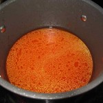 Add 6 cups of water to the tomato and pepper paste. Cover and bring to a boil until the tomato and pepper paste have dissolved thoroughly.