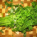 Wash curly parsley and remove leaves from stems.