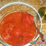 In another bowl add the canned tomatoes, tomato paste and water. Mix together till the paste has dissolved.