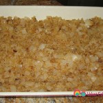 Grease a 13 x 9 baking pan and evenly spread the onion rice mixture.